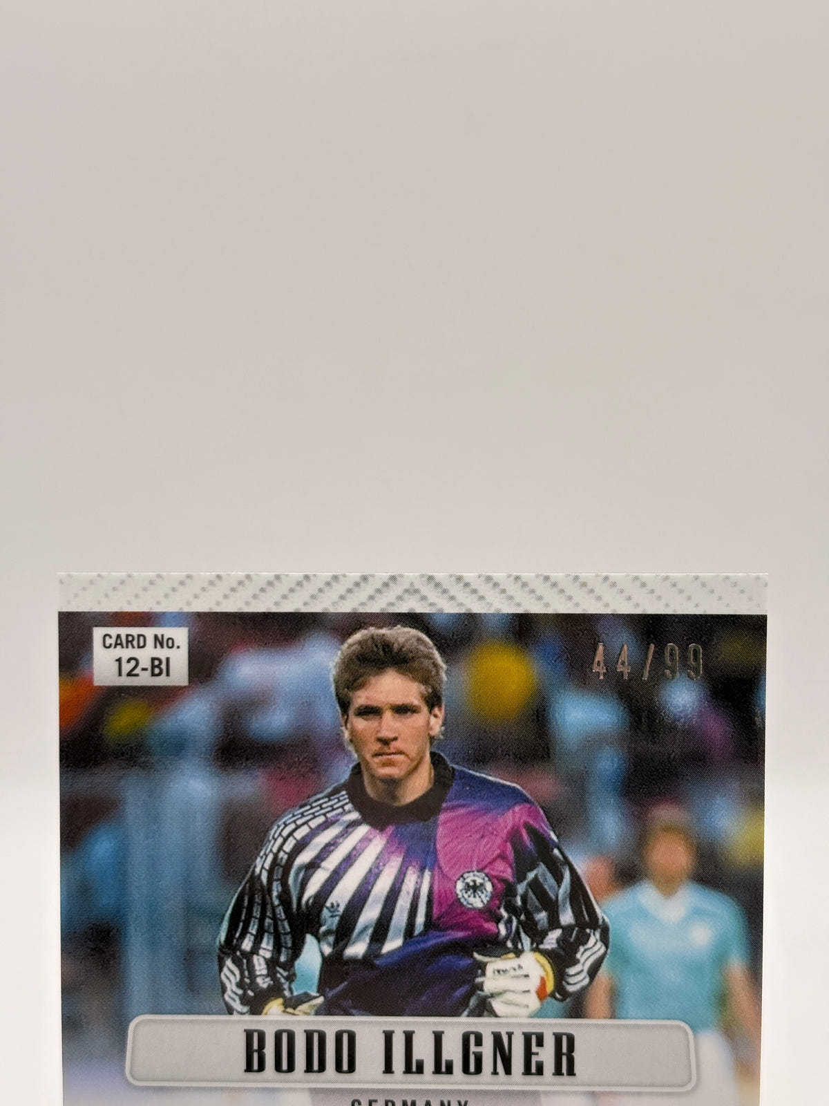 2026 Panini Fifa World Cup 2026 - #12-BI Bodo Illgner Auto Red 44/99, photo 3 image 3