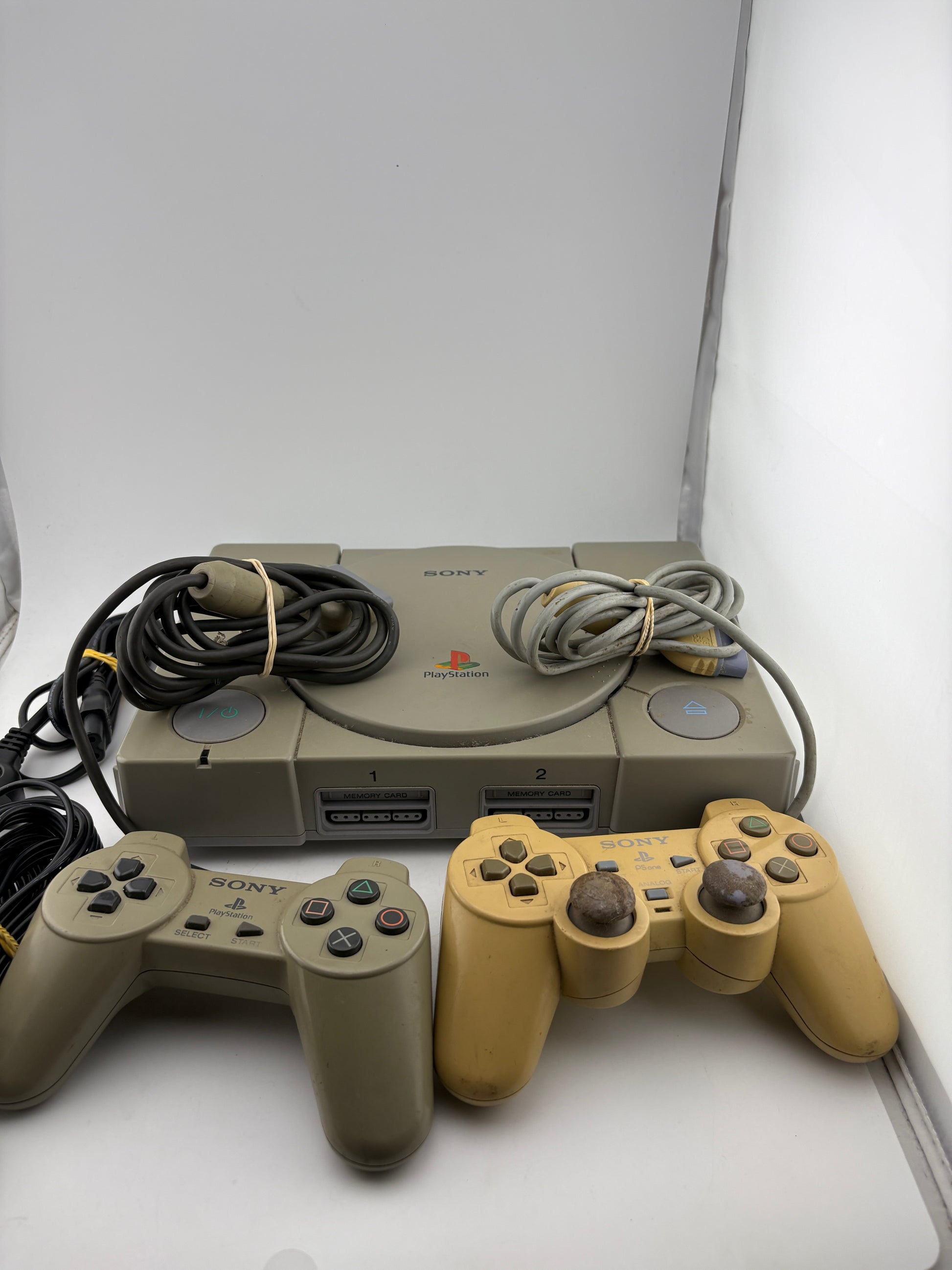 Original PlayStation One Console with 2 Controllers and Cabels (Power Tested Turns On)