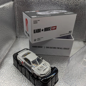 Kaido House x Mini GT Nissan Skyline GT-R R34 Works V1 KHMG049 1/64 WHITE FRENLY BRICKS - Open 7 Days