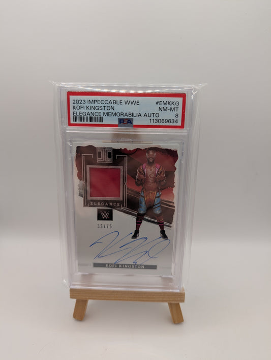 2023 Panini Impeccable Elegance Kofi Kingston EM-KKG /75 Auto Memorabilia PSA 8 FRENLY BRICKS - Open 7 Days